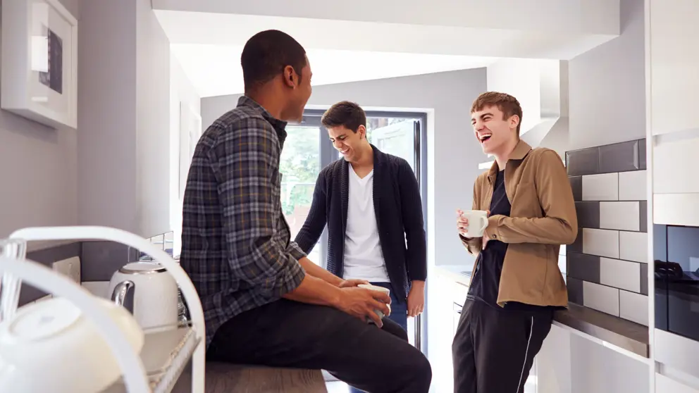 Students In Kitchen Group Talking