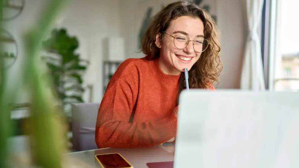 Girl Student On Laptop With Phone