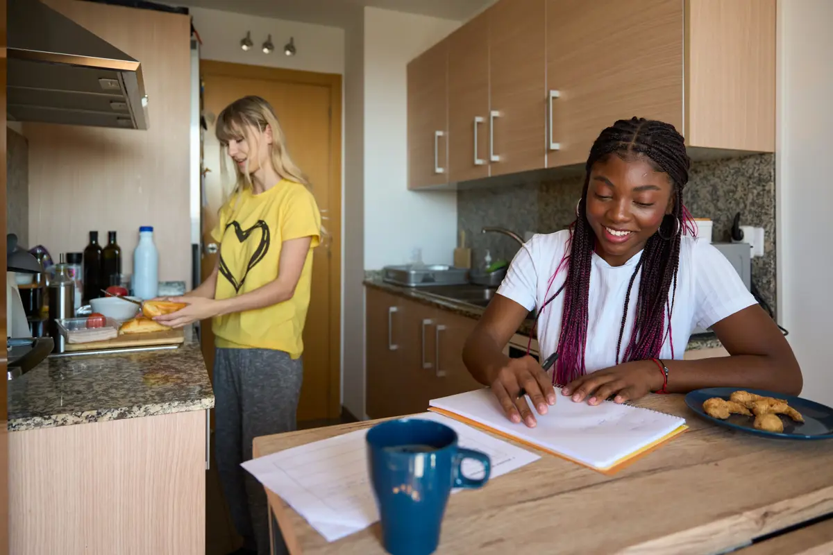 Students In Kitchen With Tea Studying