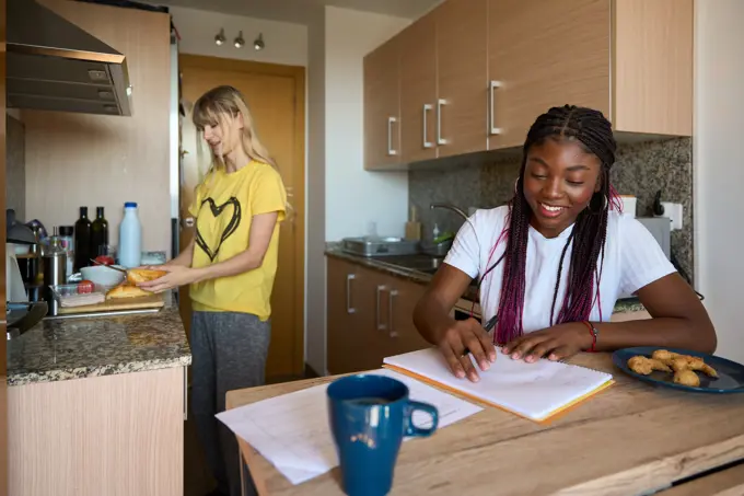 Students In Kitchen With Tea Studying